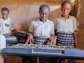 Students playing electronic keyboards