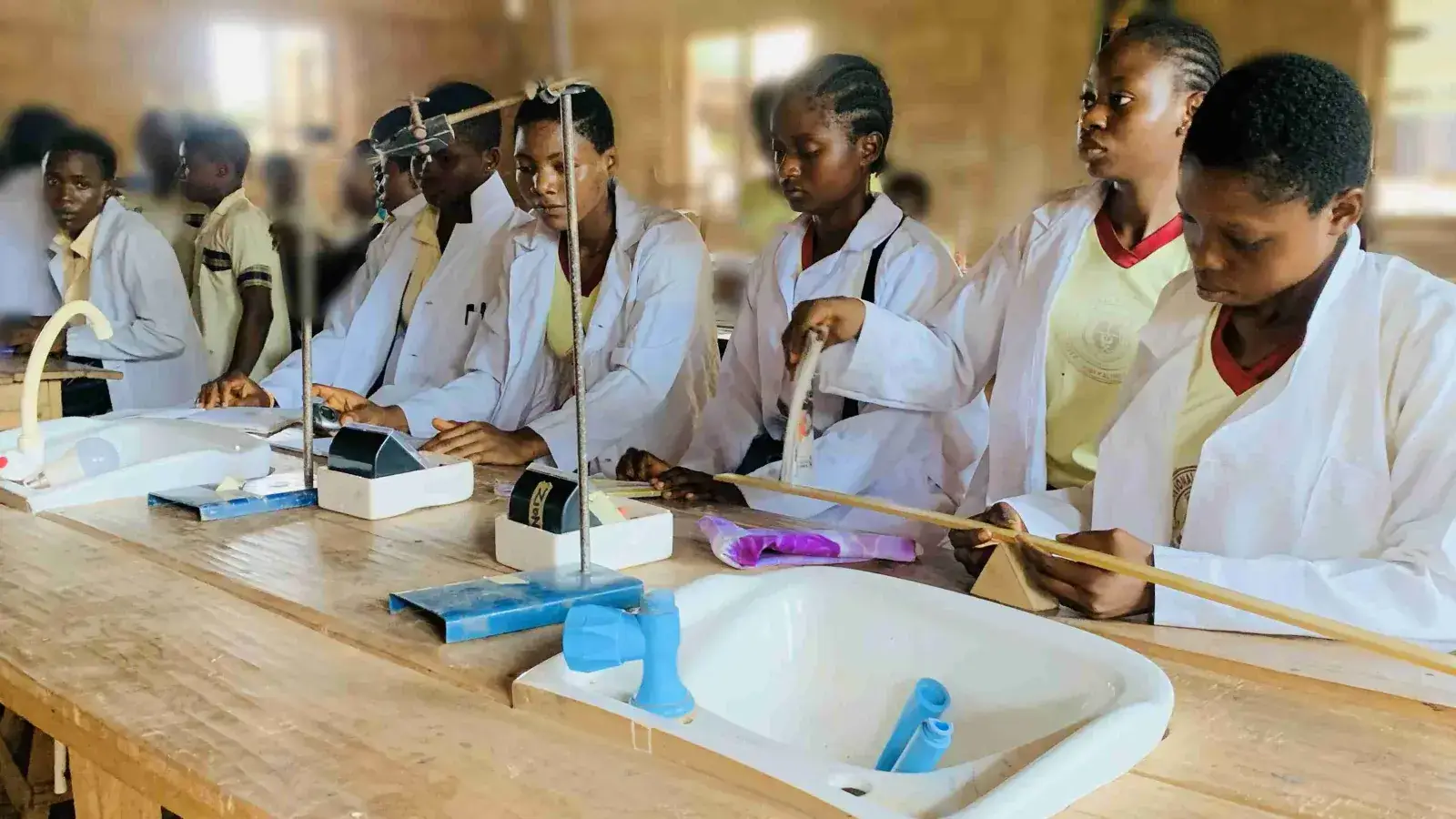 Students conducting a physics practical