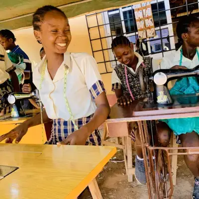 Tailoring students at sewing machines
